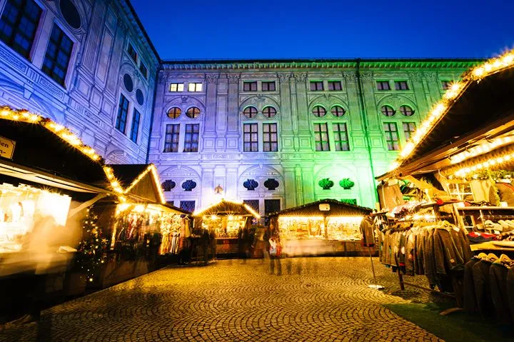 A beautifully lit Christmas market at night in Ireland