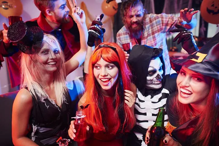 Groups in Halloween costumes celebrating outdoors in Dublin