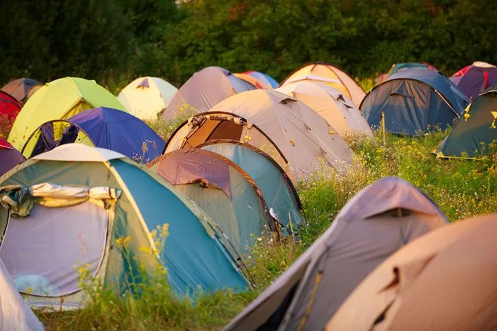Festival tents at sunset — camping at an Irish traditional music festival